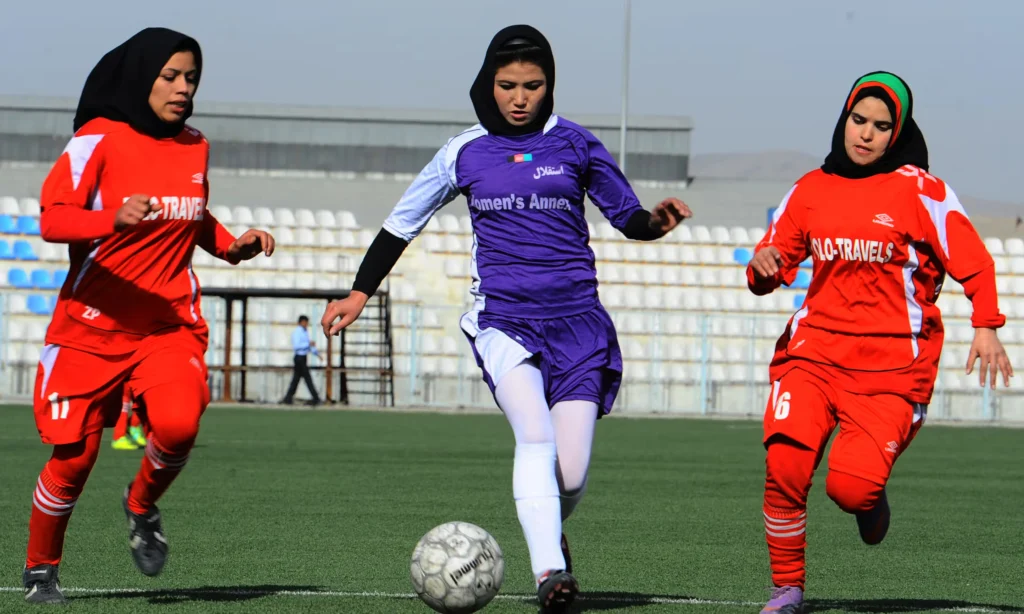 FIFA clears exiled Afghanistan women's team to compete but faces criticism for delays in recognition and support. [Image via AFP/Getty Images]