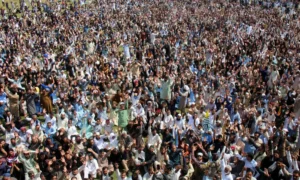 Supporters of the Joint Awami Action Committee (JAAC) chant slogans as they gather to attend the funeral of men who were killed during a protest following a shutter-down strike in Muzaffarabad on October 2, 2025. — Reuters