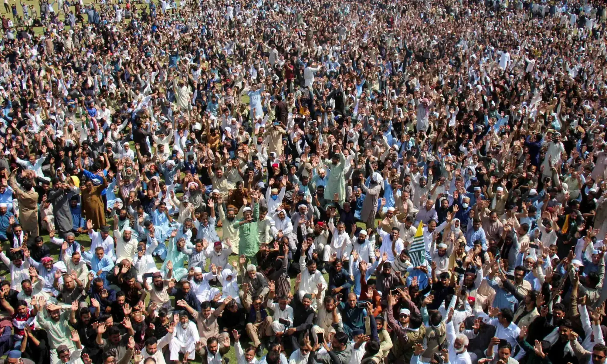 Supporters of the Joint Awami Action Committee (JAAC) chant slogans as they gather to attend the funeral of men who were killed during a protest following a shutter-down strike in Muzaffarabad on October 2, 2025. — Reuters