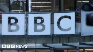 BBC newsroom used to illustrate discussions about editorial standards, conflict reporting, and terminology used for designated terrorist organisations.